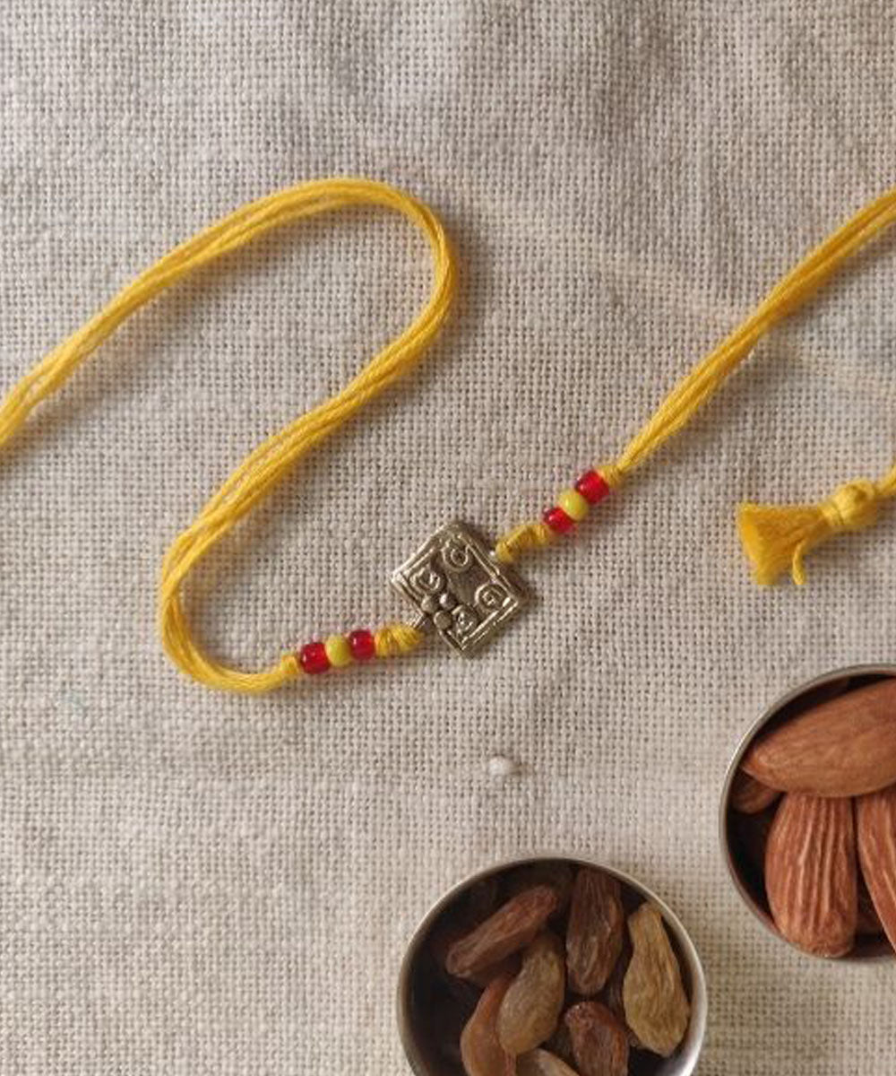 Yellow hand made thread rakhi