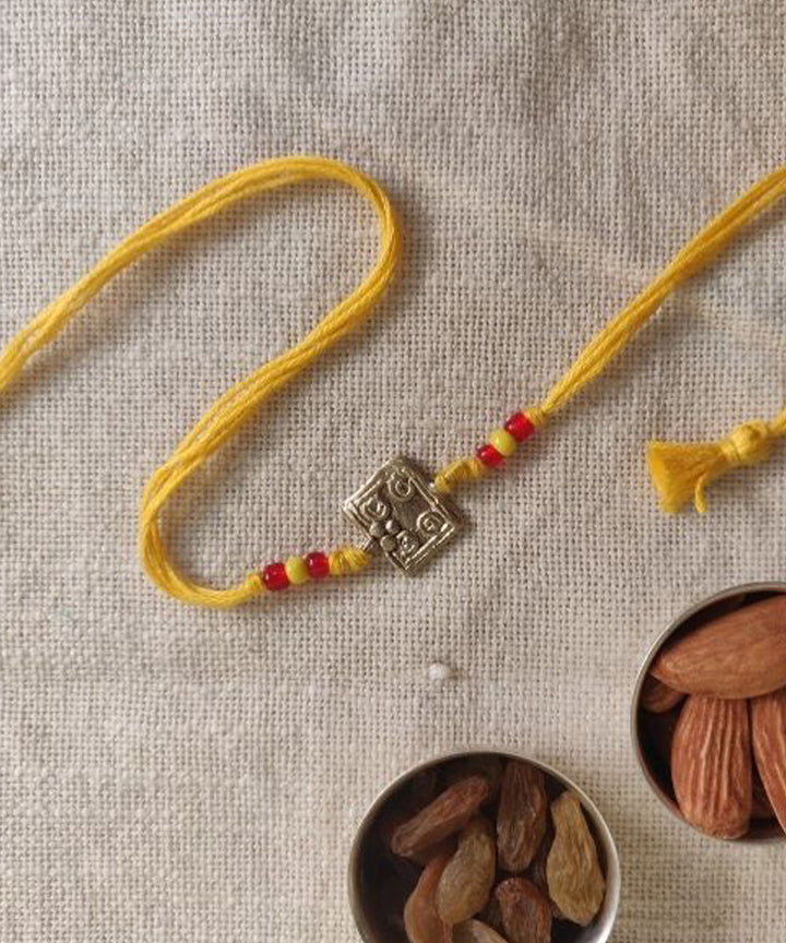 Yellow hand made thread rakhi