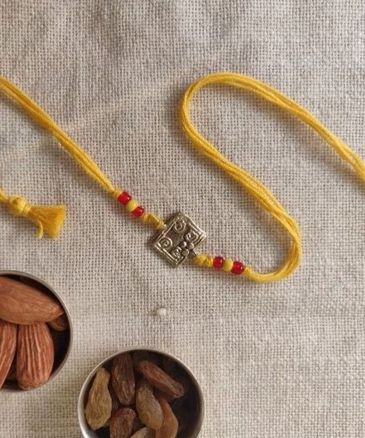 Yellow hand made thread rakhi