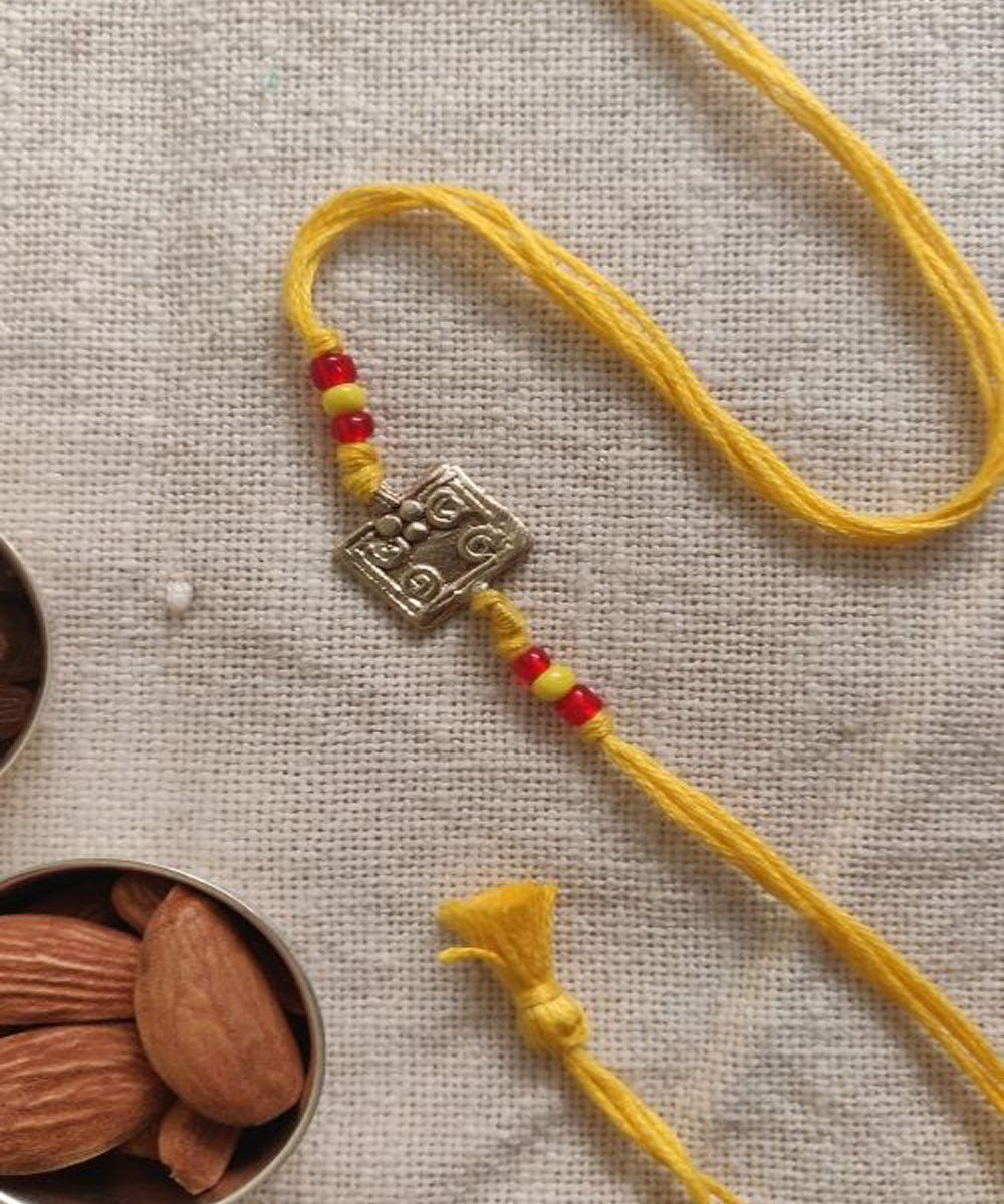 Yellow hand made thread rakhi