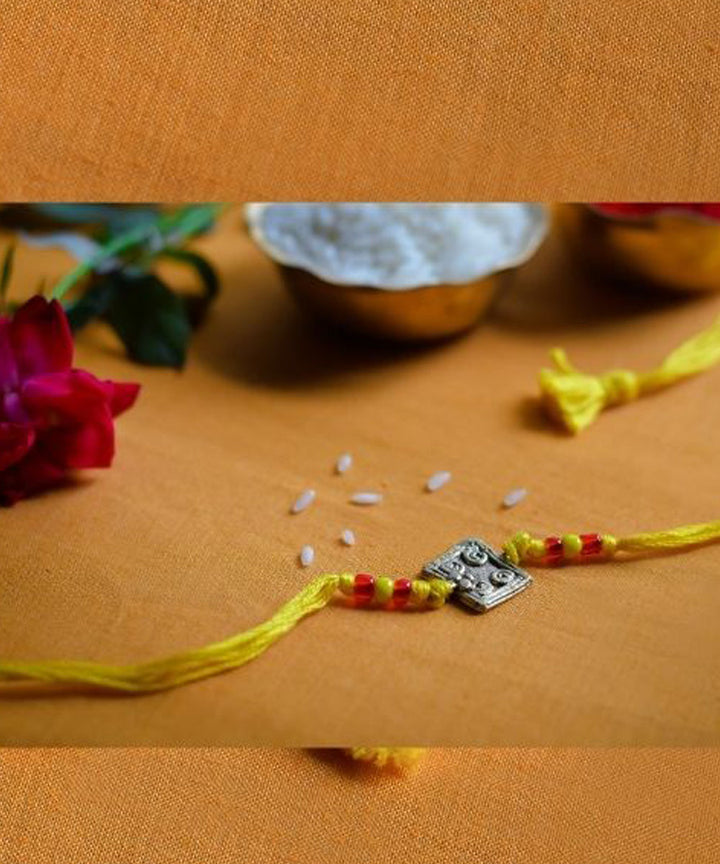 Yellow hand made thread rakhi