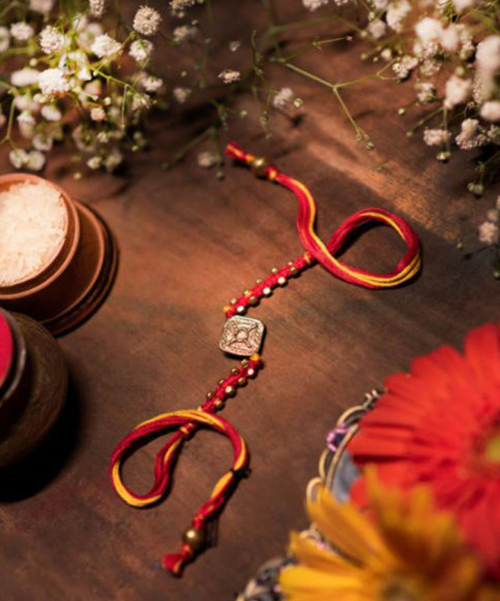 Red yellow thread handmade rakhi