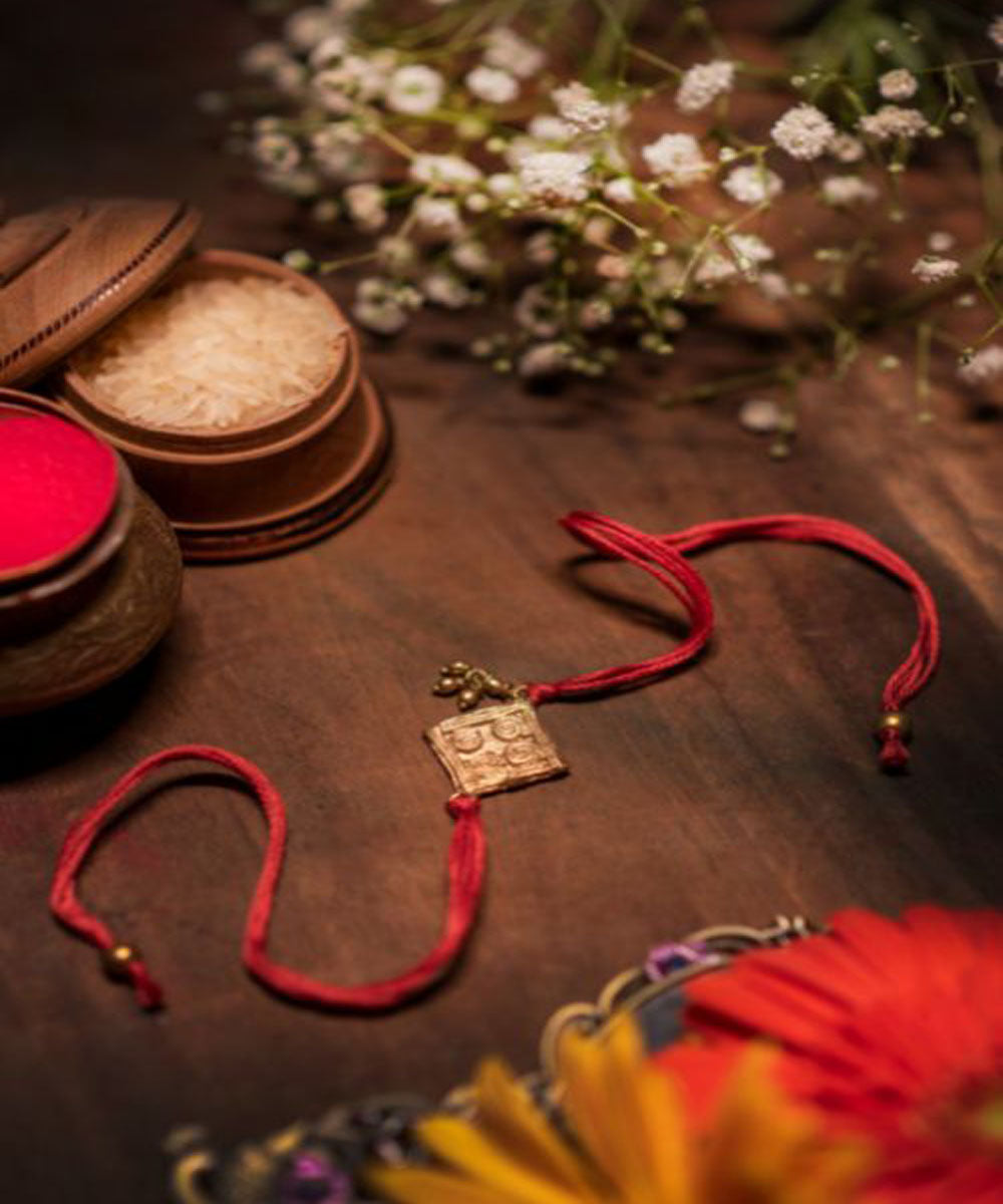 Red beautiful thread hand made rakhi