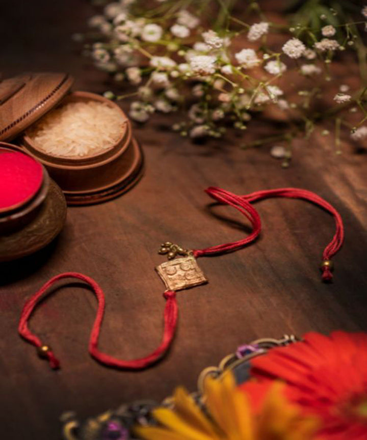 Red beautiful thread hand made rakhi