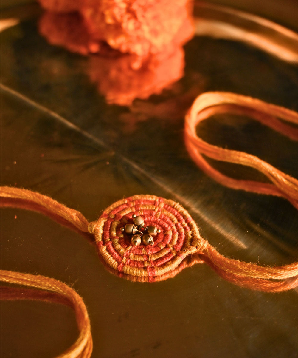 Yellow hand crafted thread rakhi