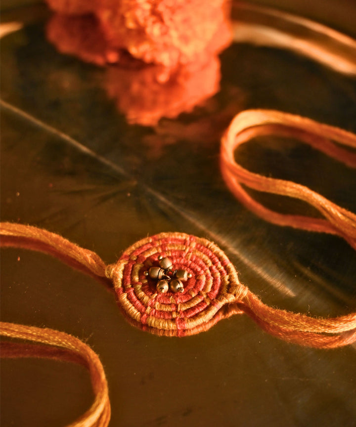 Yellow hand crafted thread rakhi