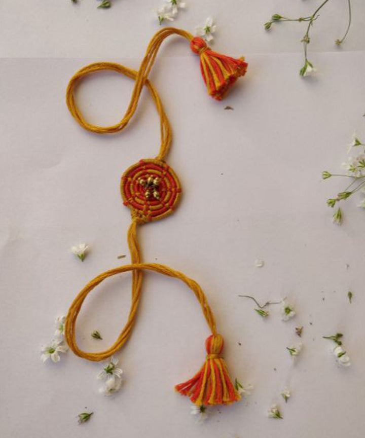 Yellow hand crafted thread rakhi