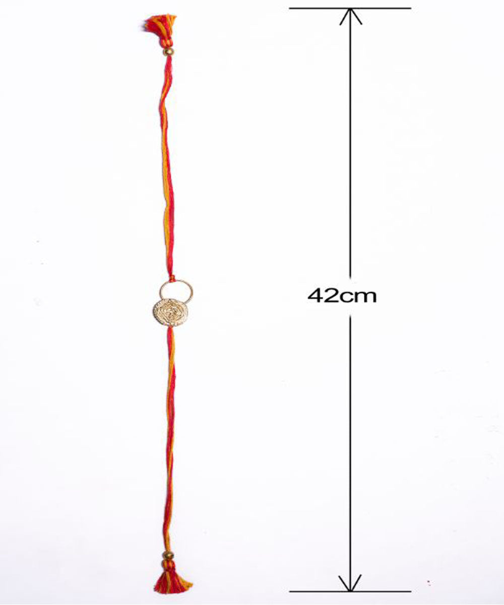 Orange thread crafted rakhi