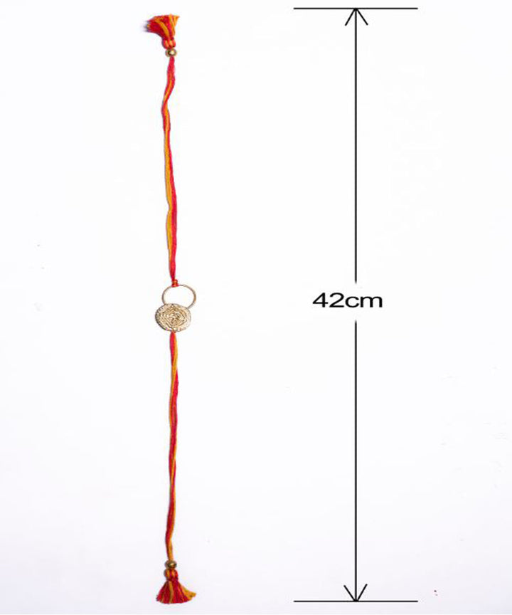 Orange thread crafted rakhi