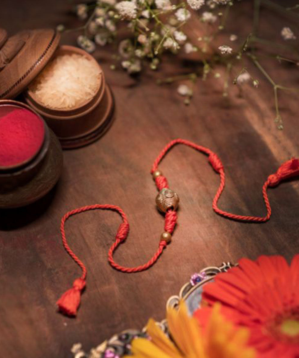 Yellow orange handmade thread rakhi
