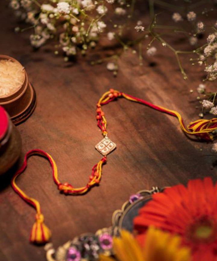 Purple orange handmade thread rakhi