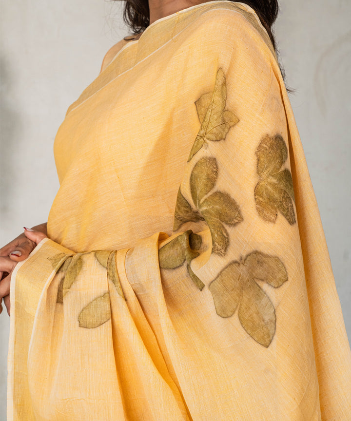 Soft pumpkin orange cotton hand dyed with turmeric bio print saree