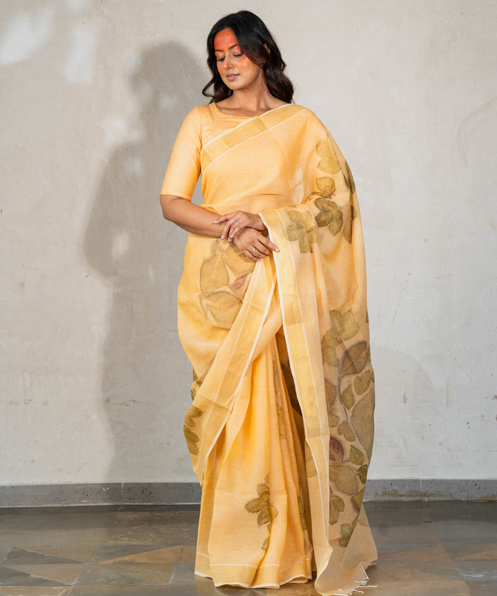 Soft pumpkin orange cotton hand dyed with turmeric bio print saree
