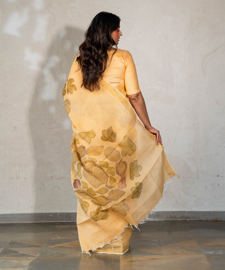 Soft pumpkin orange cotton hand dyed with turmeric bio print saree