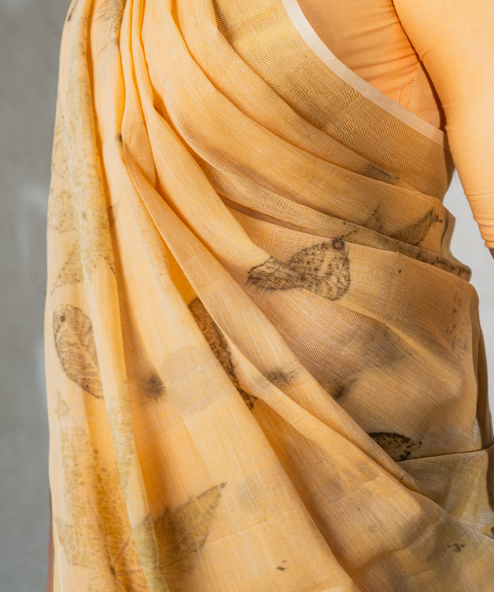 Soft pumpkin orange cotton hand dyed turmeric bio print saree