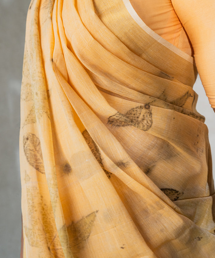 Soft pumpkin orange cotton hand dyed turmeric bio print saree