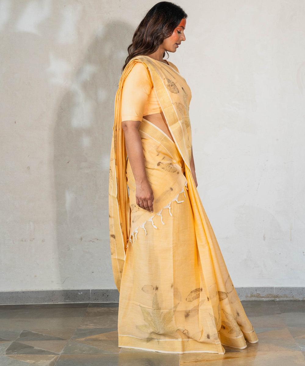 Soft pumpkin orange cotton hand dyed turmeric bio print saree