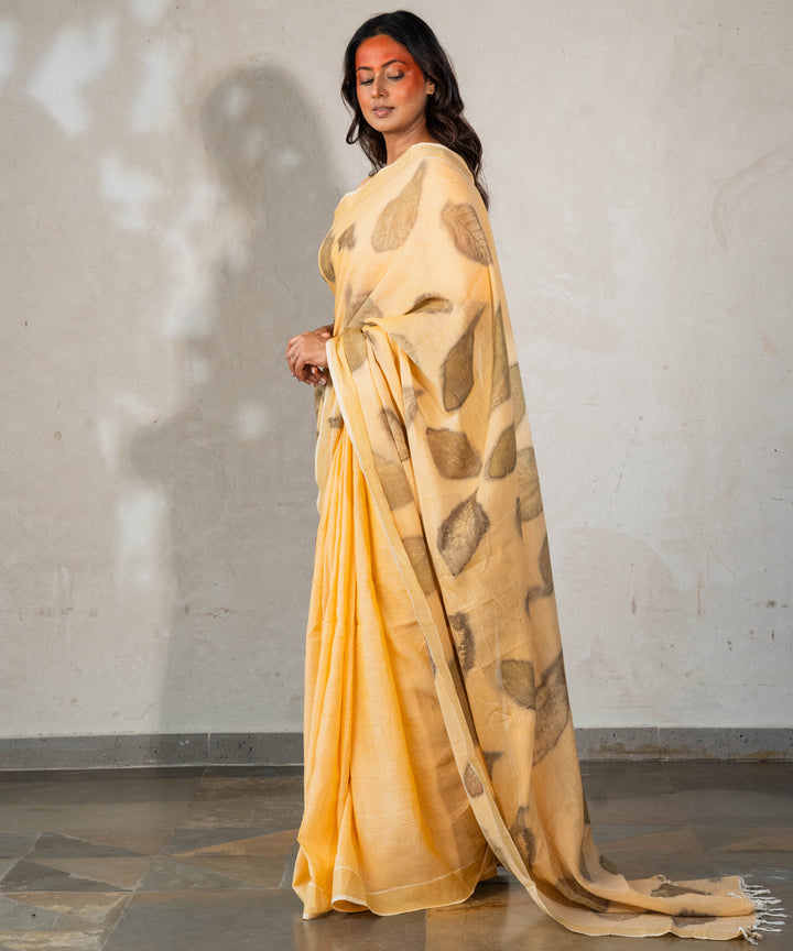 Soft pumpkin orange cotton hand dyed with turmeric bio printed saree