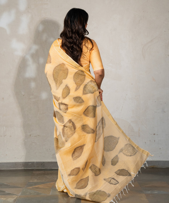 Soft pumpkin orange cotton hand dyed with turmeric bio printed saree