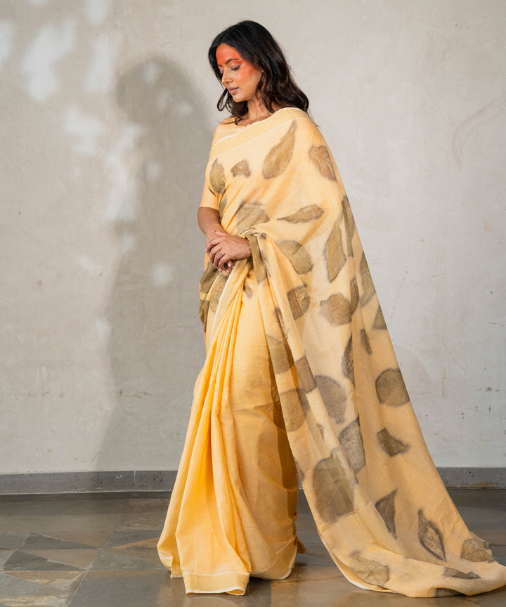 Soft pumpkin orange cotton hand dyed with turmeric bio printed saree