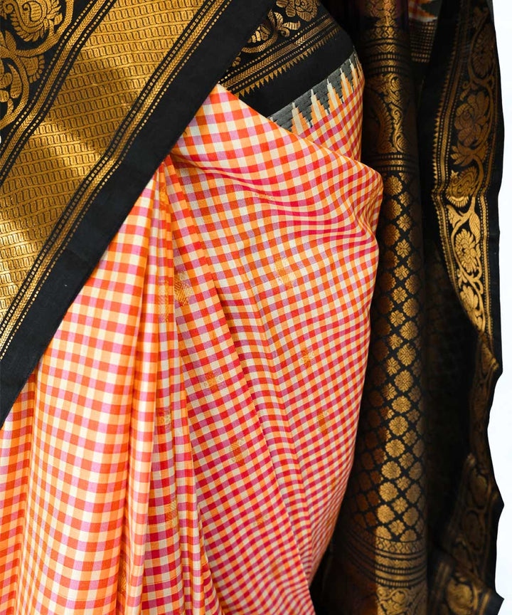 Red and peach checks silk gadwal saree with temple border
