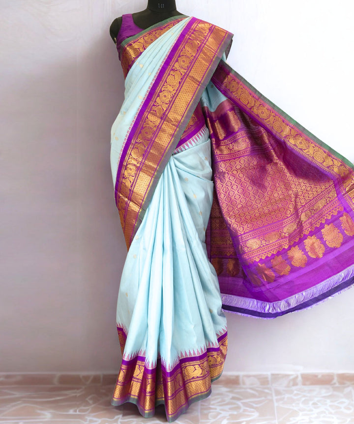 Powder blue silk gadwal saree with temple border
