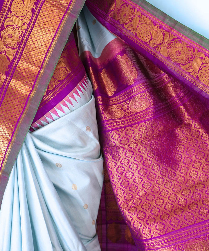 Powder blue silk gadwal saree with temple border