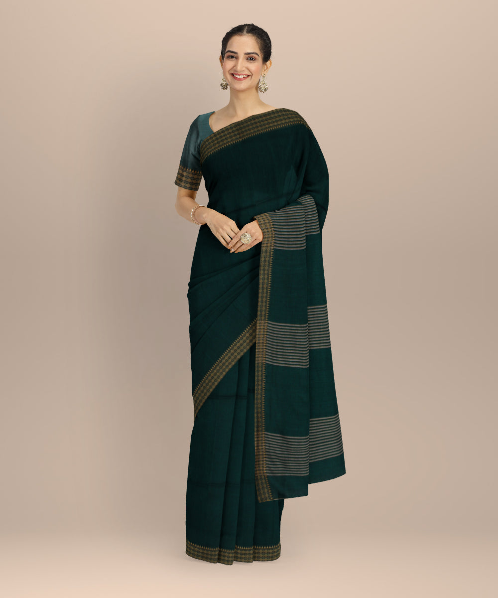 Dark green plain handwoven cotton jamdani saree