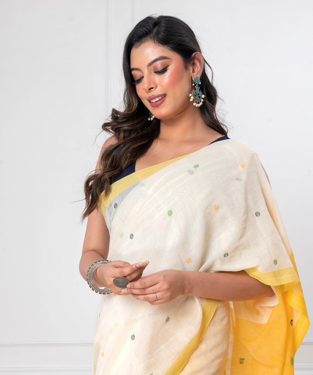 White yellow mul cotton handloom jamdani saree with tassels