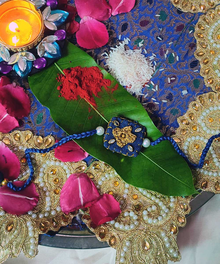 Blue handcrafted thread work upcycled fabric rakhi