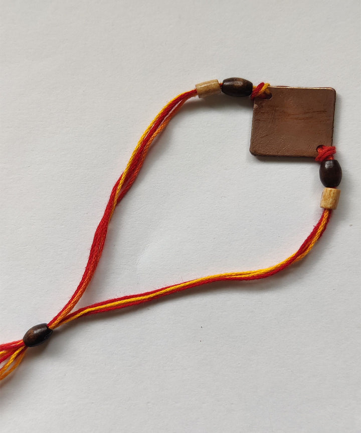 Yellow orange handmade copper enamelling rakhi