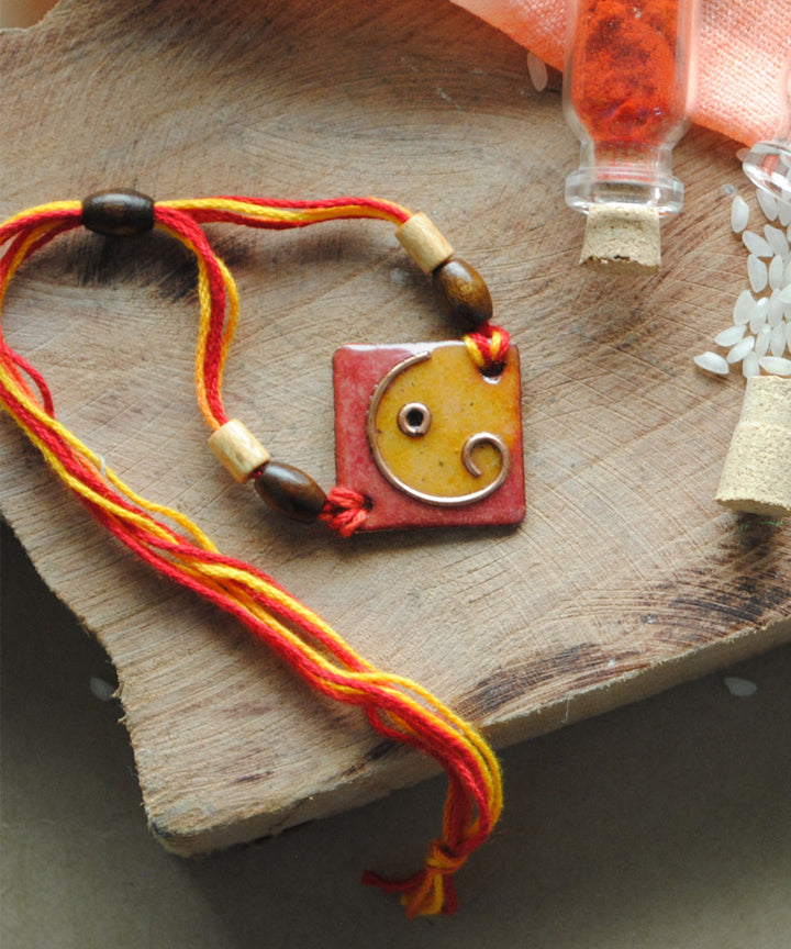 Yellow orange handmade copper enamelling rakhi