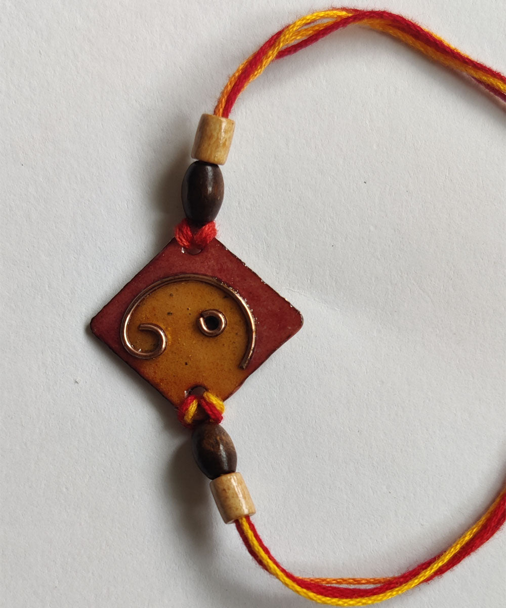 Yellow orange handmade copper enamelling rakhi