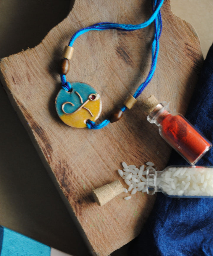 Blue yellow handmade copper enamelling rakhi