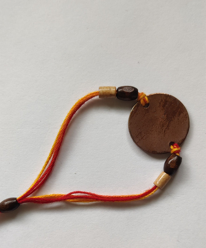 Yellow orange handcrafted copper enamelling rakhi