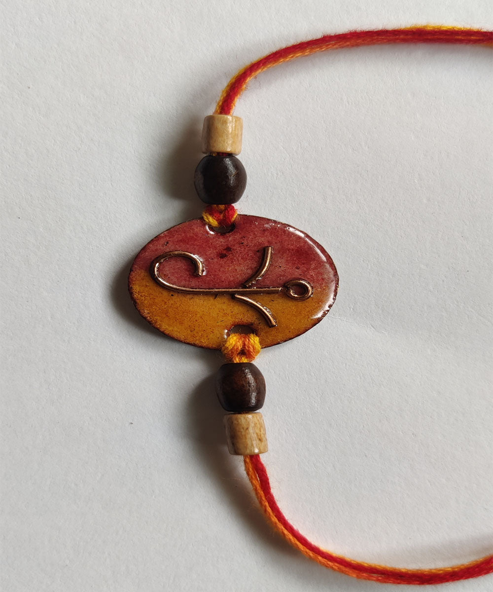 Yellow orange handcrafted copper enamelling rakhi