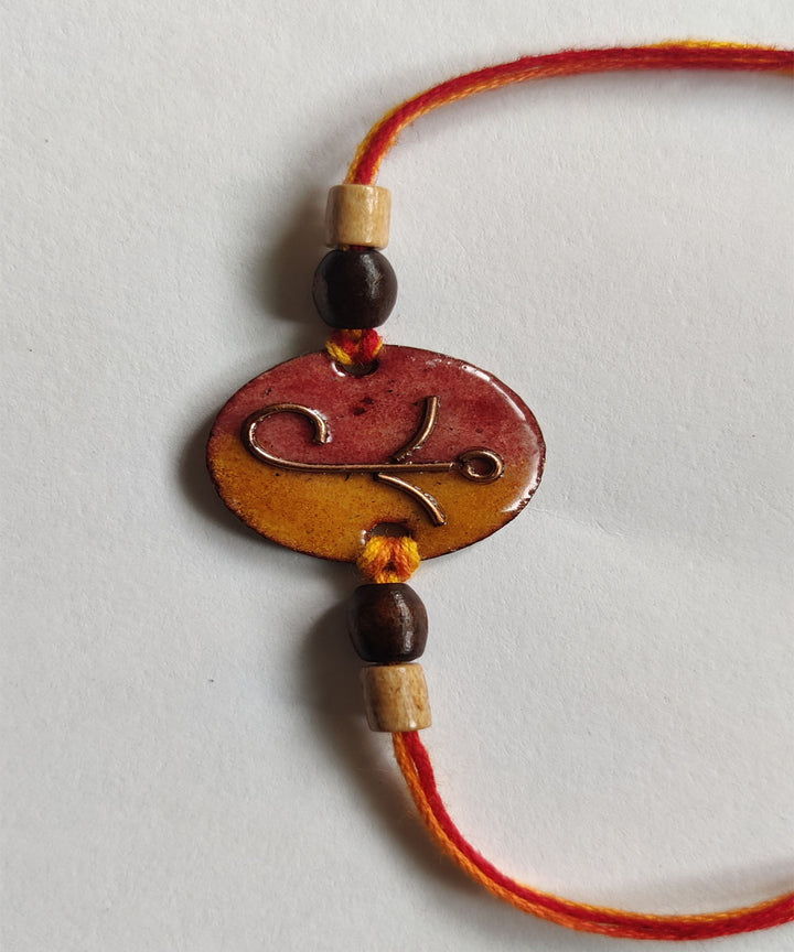 Yellow orange handcrafted copper enamelling rakhi