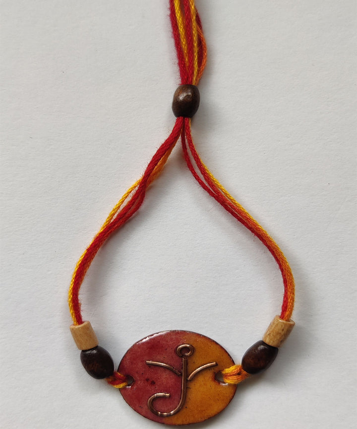 Yellow orange handcrafted copper enamelling rakhi