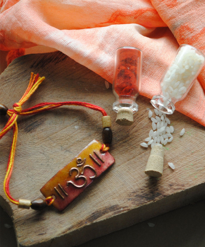 Orange copper enamelling handmade rakhi