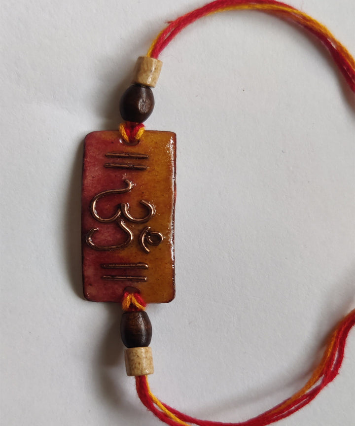 Orange copper enamelling handmade rakhi