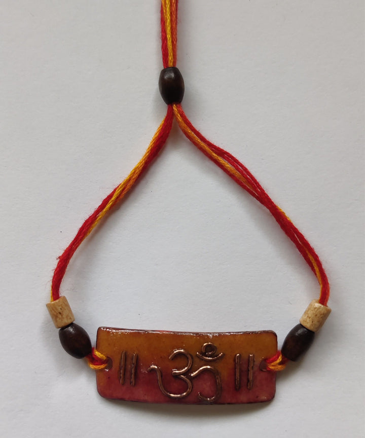Orange copper enamelling handmade rakhi