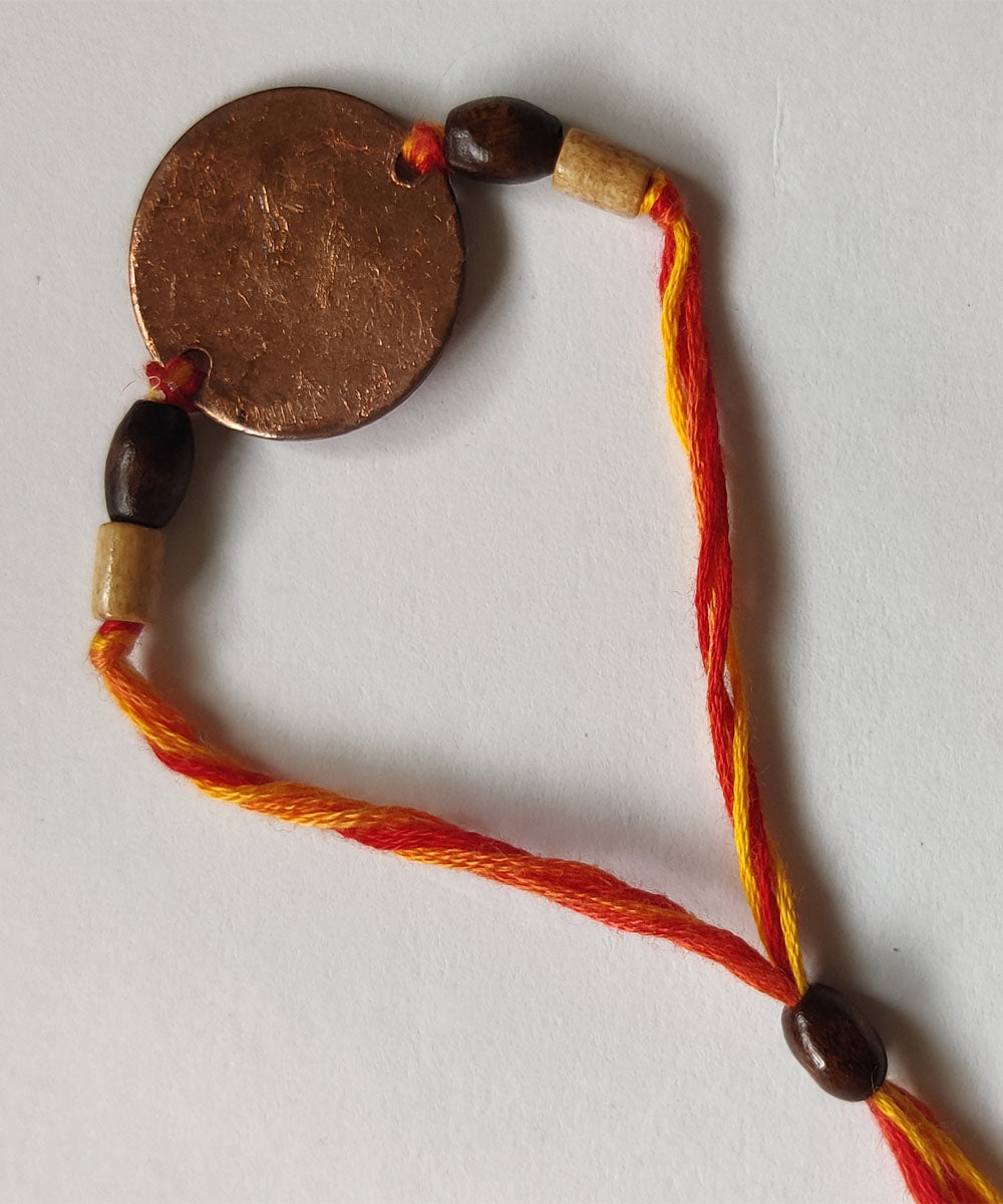 Orange handcrafted enamelling copper rakhi