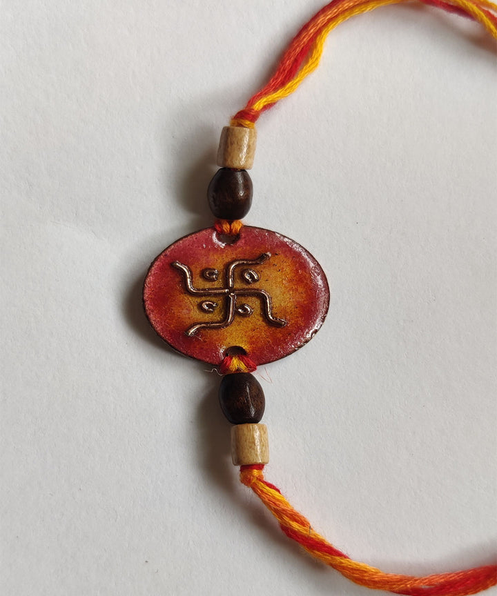 Orange handcrafted enamelling copper rakhi