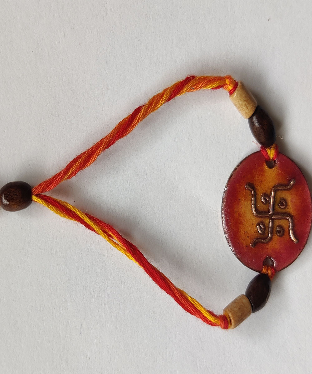 Orange handcrafted enamelling copper rakhi
