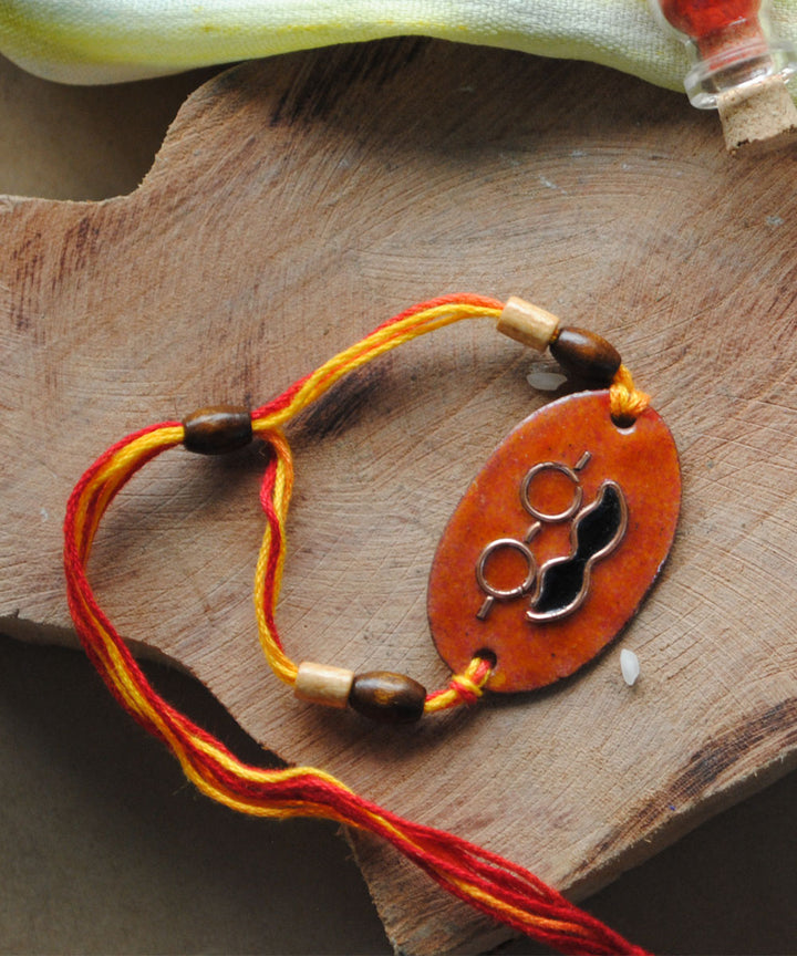 Orange handmade enamelling copper rakhi