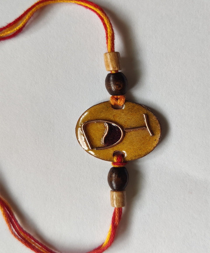 Orange handmade enamelling copper rakhi