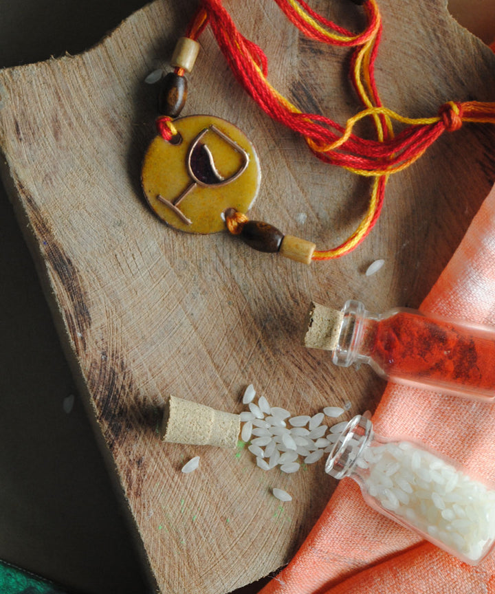 Yellow orange handmade enamelling rakhi