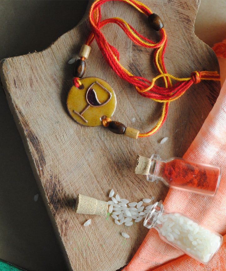 Yellow orange handmade enamelling rakhi