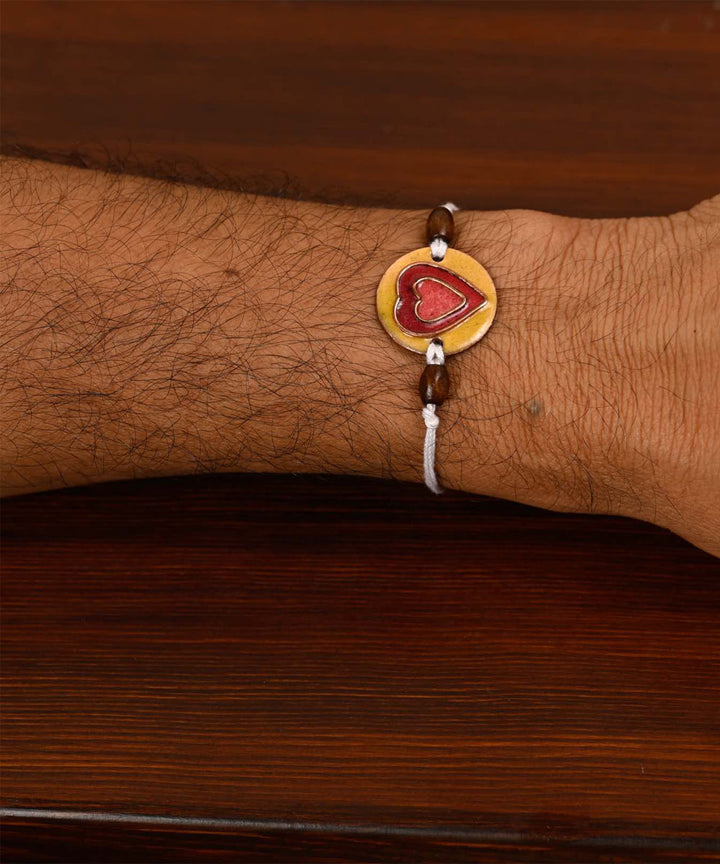 Red handmade copper enamelling rakhi