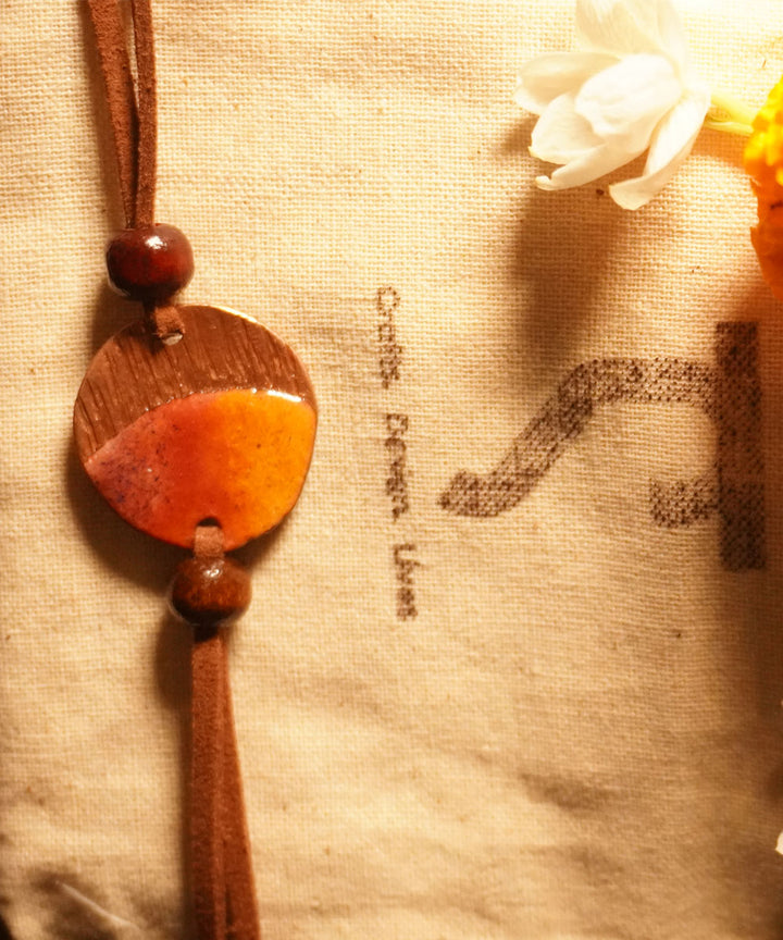 Yellow brown handmade copper enamelling rakhi